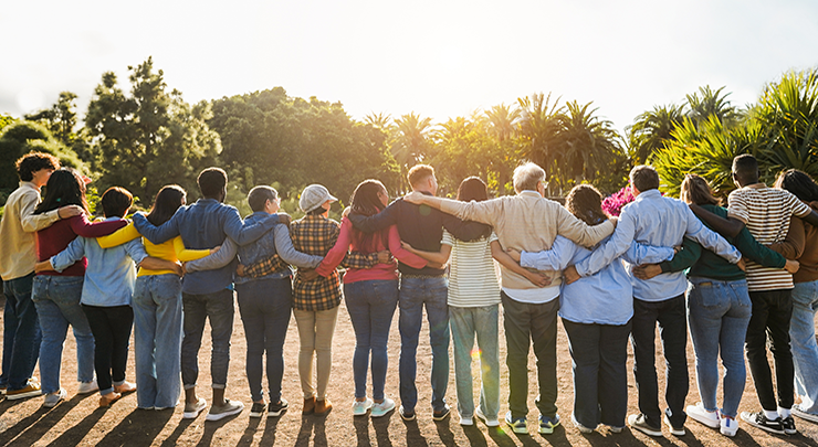 Group of multigenerational people hugging each other