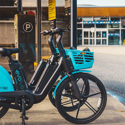 Evolve bikes parked near the station
