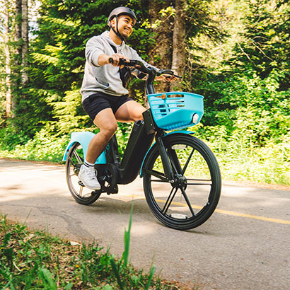 Young man cycling in the woods