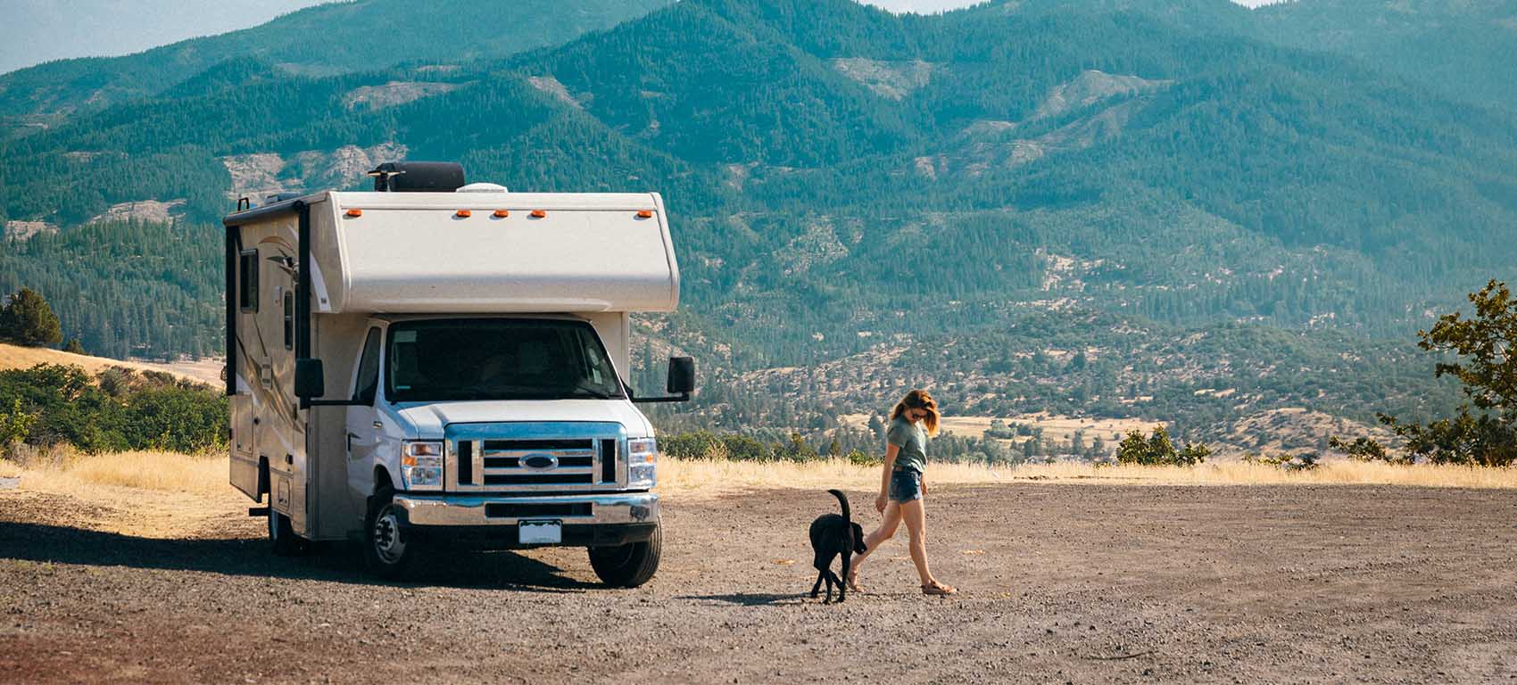 woman and dog travelling on RV