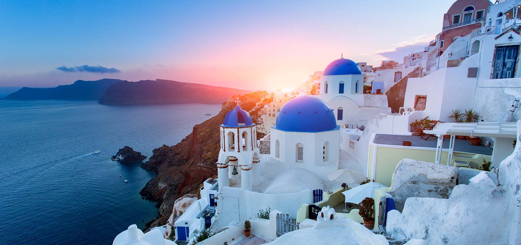 Blue domed churches at sunset, Oia, Santorini