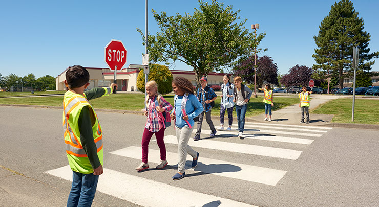 School Safety Patrol letting children cross