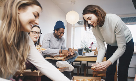 Young people sharing pizza