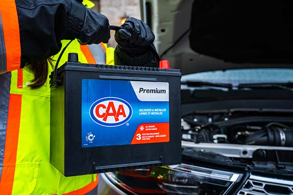 CAA Battery being lifted into car